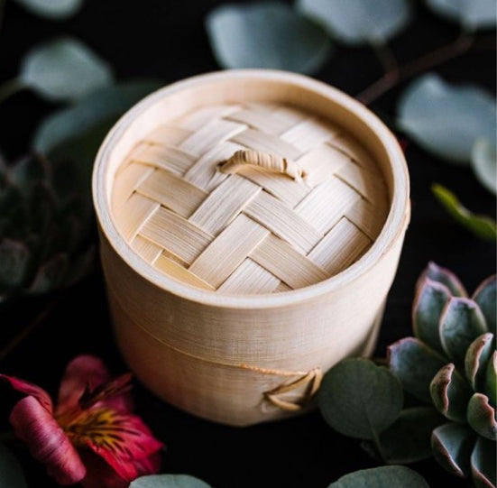 Bamboo Steamer by flowers and plants